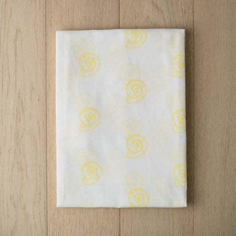 products/pearly-shell-swaddle-in-yellow-2.jpg